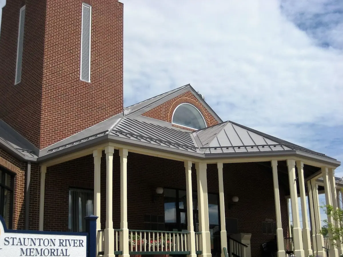 Skilled roofing craftsmen working on a residential roof in Lincroft